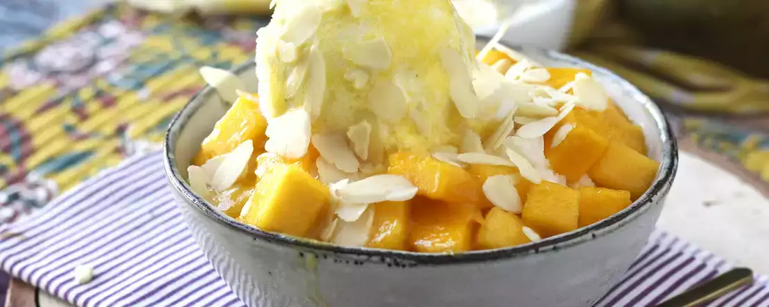 Mango bingsu, herkullinen korealainen jälkiruoka, jossa on mangoa ja joka on maailmanlaajuinen hitti.
